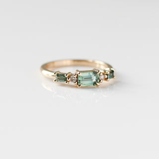 Yellow gold ring with green sapphires, quarter view