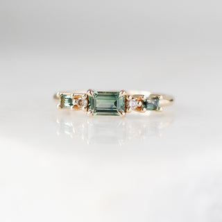 Yellow gold ring with green sapphires, front view