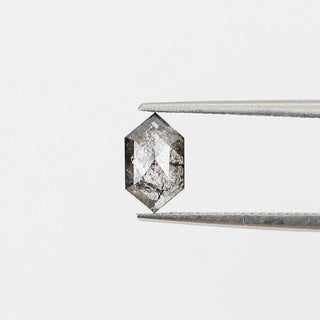 Hexagon shaped salt and pepper diamond in tongs