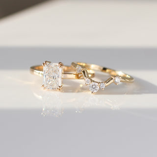 Yellow gold contour band with white diamonds and a yellow gold ring with a white diamond, side by side front view