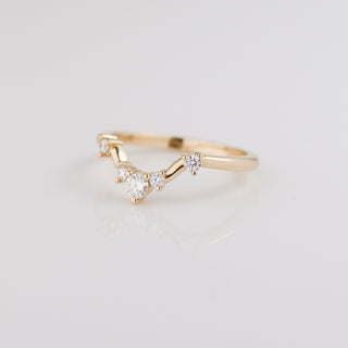 Yellow gold contour band with white diamonds, quarter view