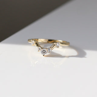 Yellow gold contour band with white diamonds, quarter view