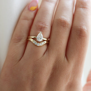 Large Diamond Wave Band with Pear Diamond ring on hand 