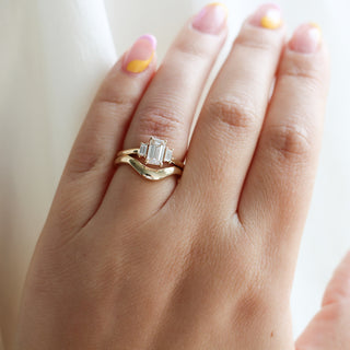 Large Wave Gold Wedding Band stacked with diamond ring on hand 