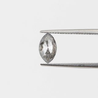 Marquise shaped salt and pepper diamond in tongs