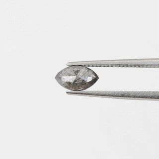 Marquise shaped salt and pepper diamond in tongs