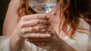 Close-up of an engagement ring with pear champagne diamond and gold band, handcrafted by Yuliya Chorna Jewellery in Toronto.