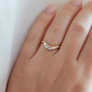 Yellow gold contour band with clear diamonds, on hand