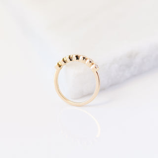 Yellow gold straight band with white diamonds, side view