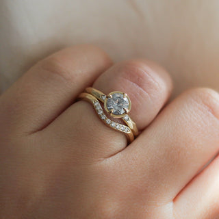 Round rose cut diamond ring in yellow gold stacked with curved diamond pave band on hand