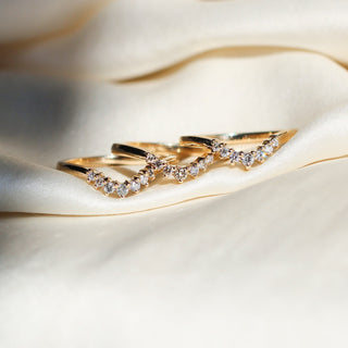 Set of three Sahara style wedding bands, quarter view on fabric