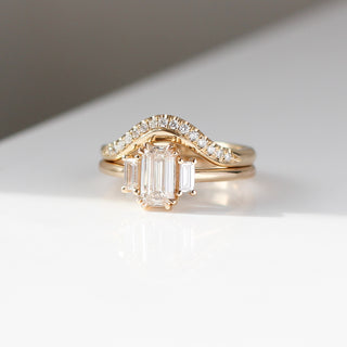 Twilight diamond wave band stacked with an emerald cut white diamond engagement ring, front view