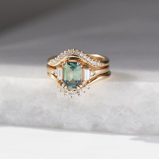 Twilight diamond wave band stacked with an emerald cut green sapphire engagement ring and a diamond wedding band, front view