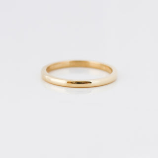 Yellow gold 2mm band on white background, front view