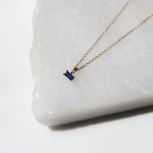 blue sapphire baguette necklace close up view