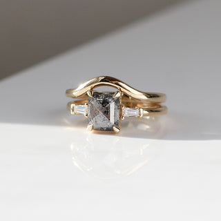 Emerald shape diamond ring with curve band