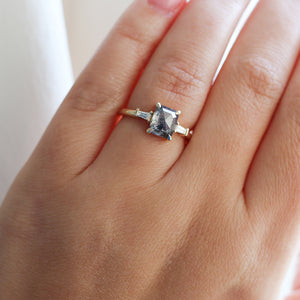 Emerald shape diamond ring on finger