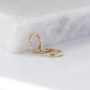 Floating Diamond Hoops on marble side profile view