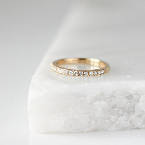 Diamond Pave Gold Band on marble side view