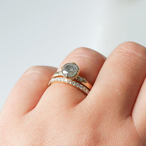 Diamond Pave Gold Band stacked with round diamond ring on hand 