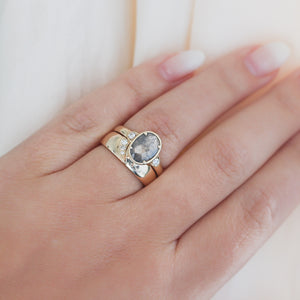 Shooting Star Diamond Ring stacked with oval salt and pepper diamond ring on hand