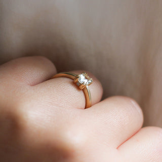 White Sapphire Gold Ring on hand profile side view