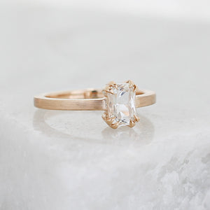 White Sapphire Gold Ring on marble quarter detail view 