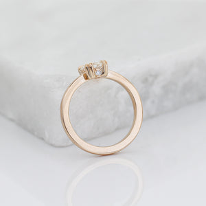 White Sapphire Gold Ring on marble side profile detail view 