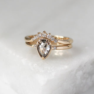 Sahara Diamond Crown in Yellow Gold stacked with pear diamond ring on marble