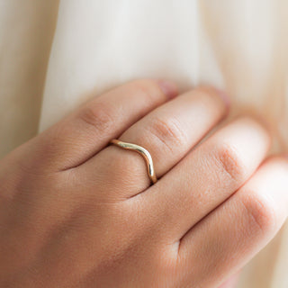 Wave Band in Yellow Gold on hand close up