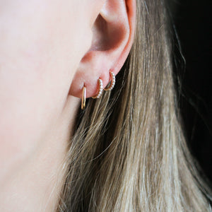 Diamond Hoops in Yellow Gold paired with simple gold hoop worn on ear