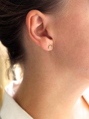 Faceted Droplet Diamond Studs on ear