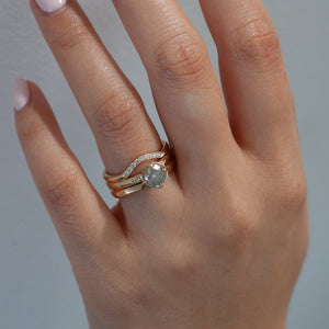 Faceted Textured Yellow Gold Ring stacked with oval diamond stacking band and a diamond ring on hand