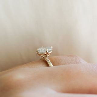 Oval cut white diamond ring on hand  side vieww