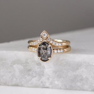 V Shaped Diamond Point Band stacked with oval salt and pepper diamond ring on marble