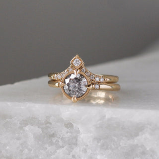 V Shaped Diamond Point Band stacked with round diamond ring on marble