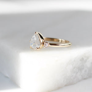 Pear icy diamond engagement ring side view