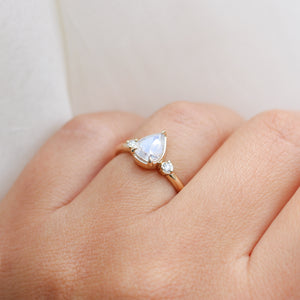 Pear icy diamond ring close up on hand