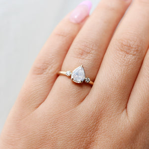 Pear icy diamond ring on hand