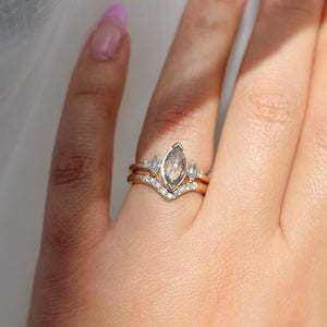 Marquise salt and pepper diamond ring with pointed diamond band on hand