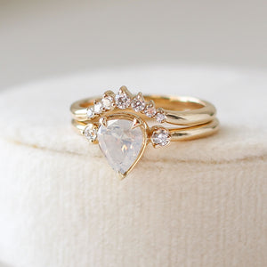 Pear shaped diamond ring with halo diamond crown