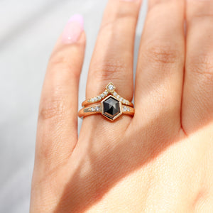 Black Diamond Ring stack on hand in sunlight close up
