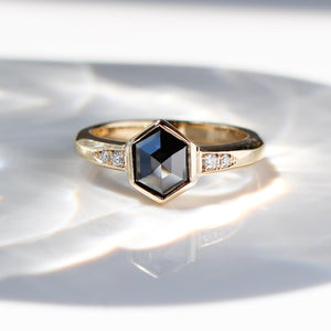 Black Diamond Ring in light on marble