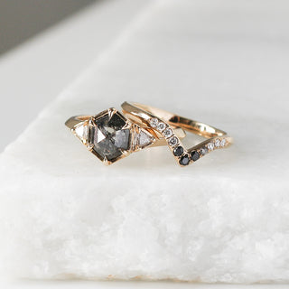 Black and Salt and Pepper Diamond Point Band stacked with Large hexagon salt and pepper diamond ring on marble side view