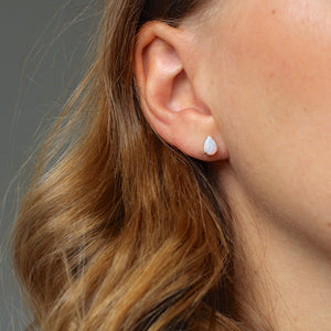 White Opal Pear Gold Studs on ear view
