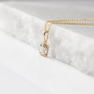 Oval Rose Cut Diamond Necklace side view on marble