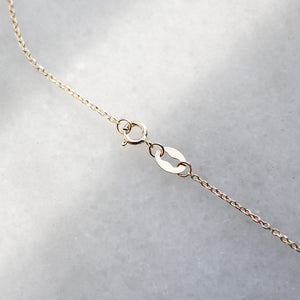 Baguette Diamond Necklace chain detail view on marble