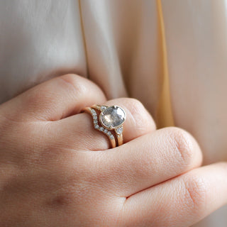 Diamond Point Gold Band stacked with oval diamond ring in light on hand 