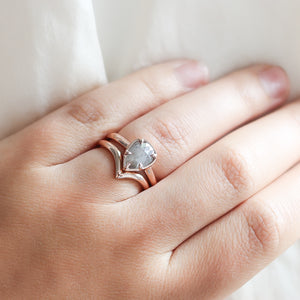 Point Band stacked with pear diamond ring on hand