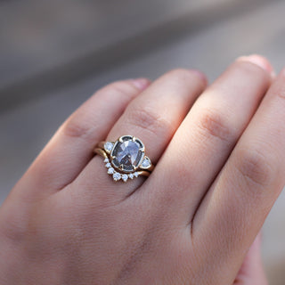 Sahara Diamond v shaped band stacked with large diamond ring on hand